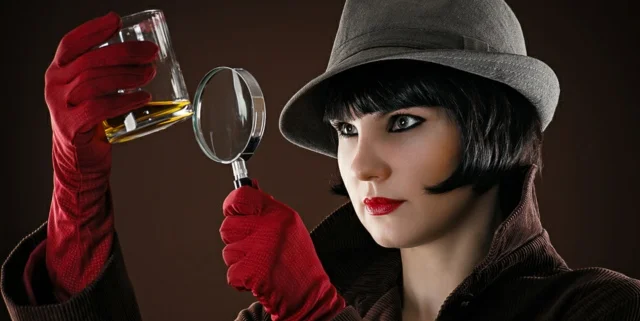 Female Detective with magnifying glass