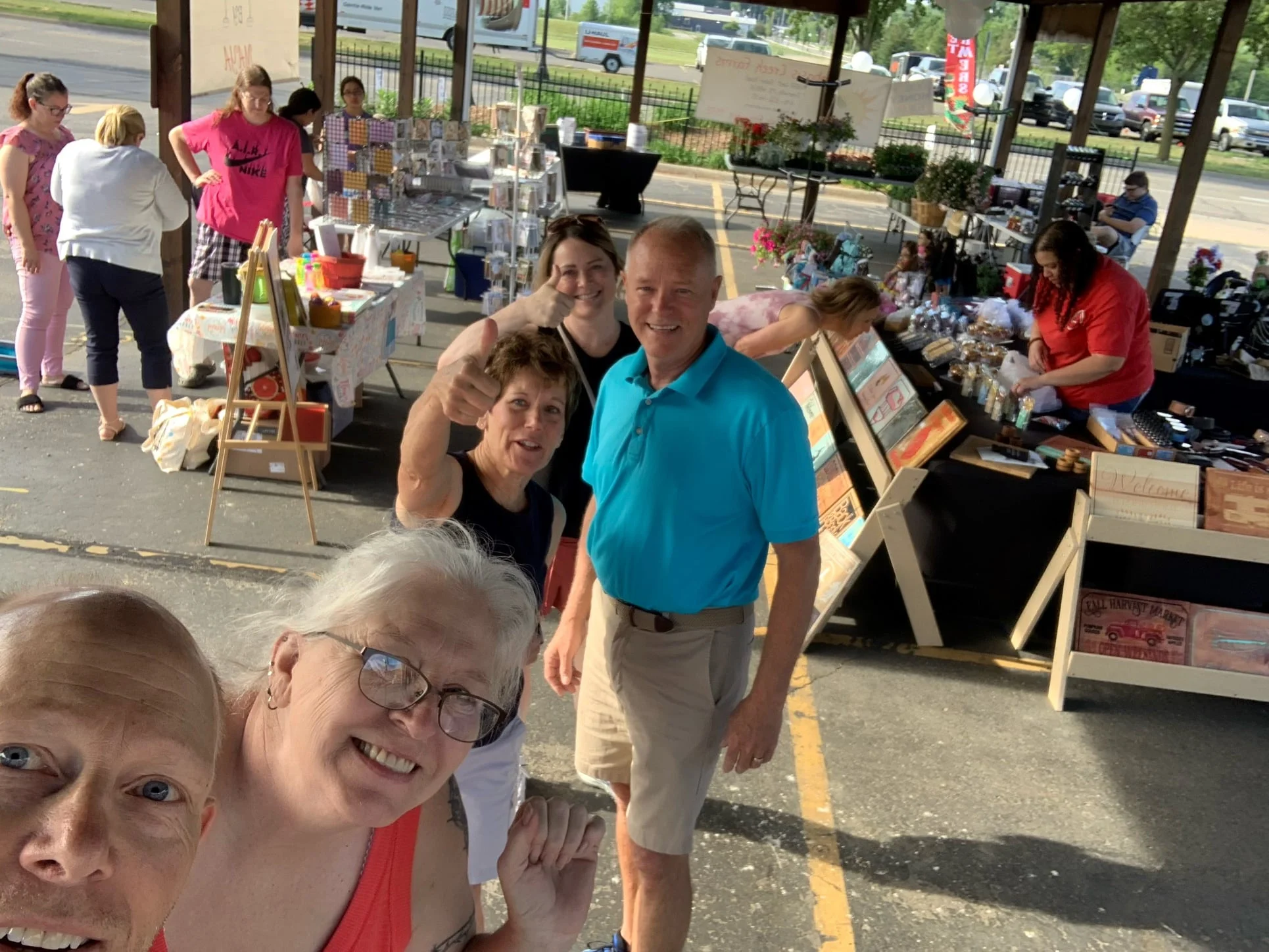 People smiling at the Farmer's Market in Ionia